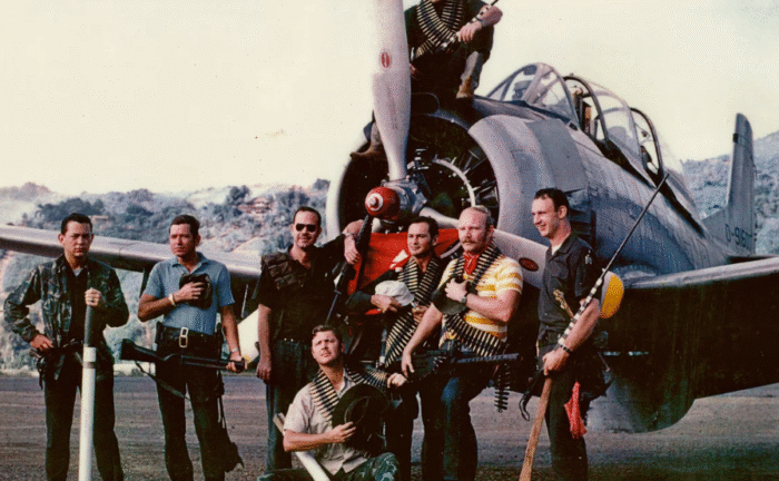 Raven forward air controllers pose for a group photo in front of a T-28 in Long Tieng in 1970. Manfred Antes/National Museum of the US Airforce